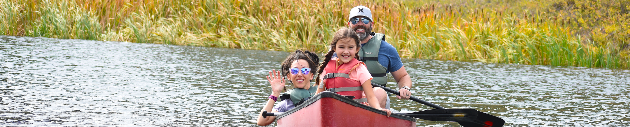 Family in a canoe on the water