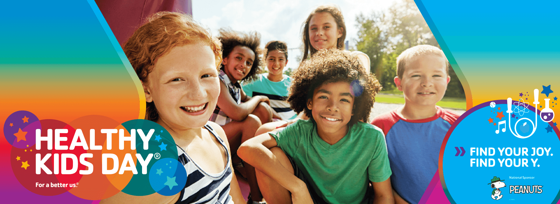A group of children smiling with the text healthy kids day for a better us. Find your joy. Find your Y.