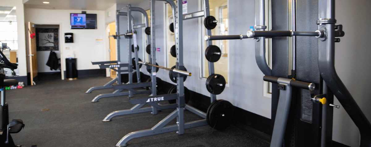 Squat racks at the Cottonwood Creek YMCA gym